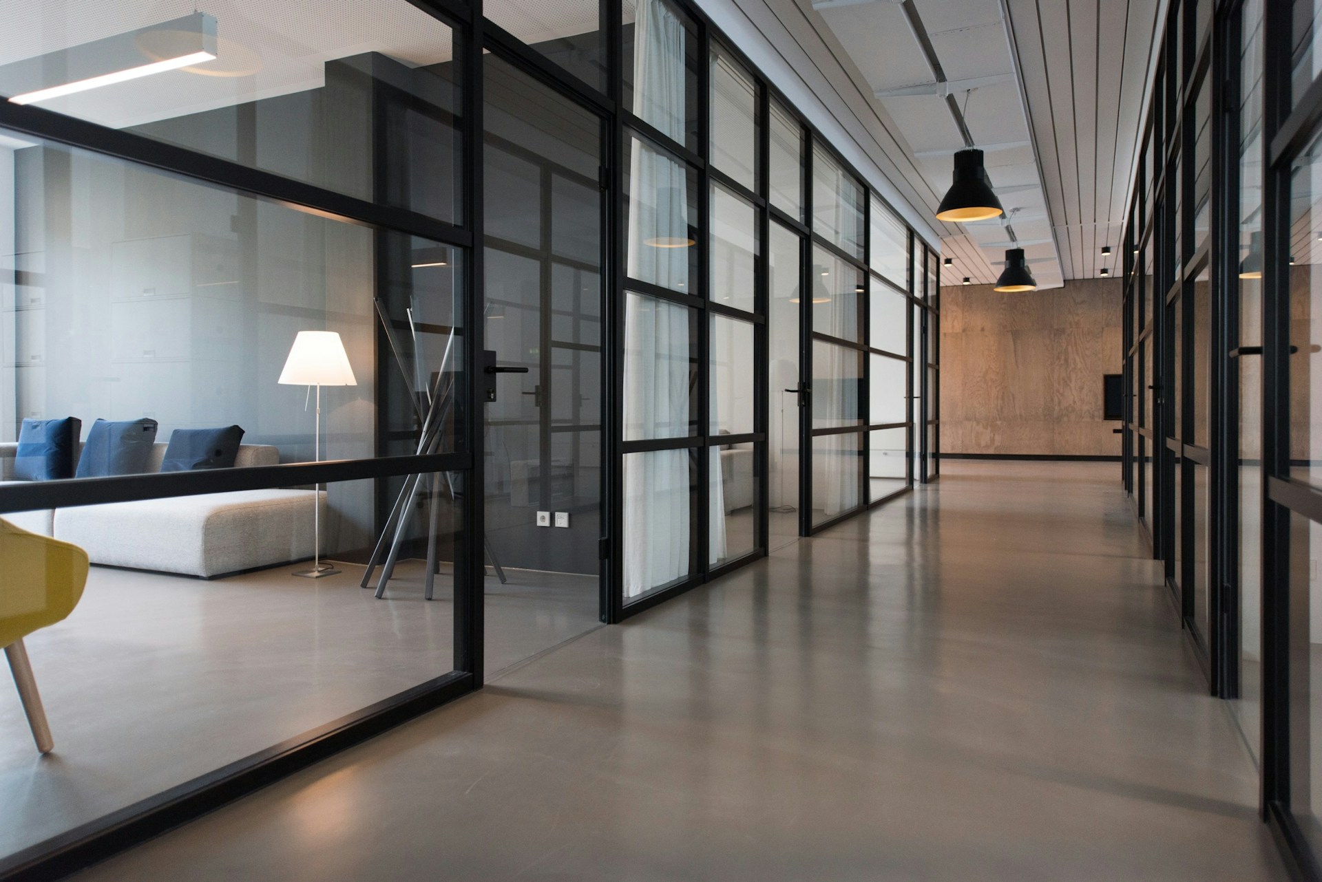 Glass-walled meeting rooms in a contemporary business office